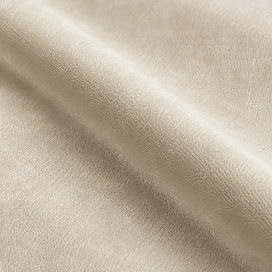 Close-up of warm ivory plain velvet pile